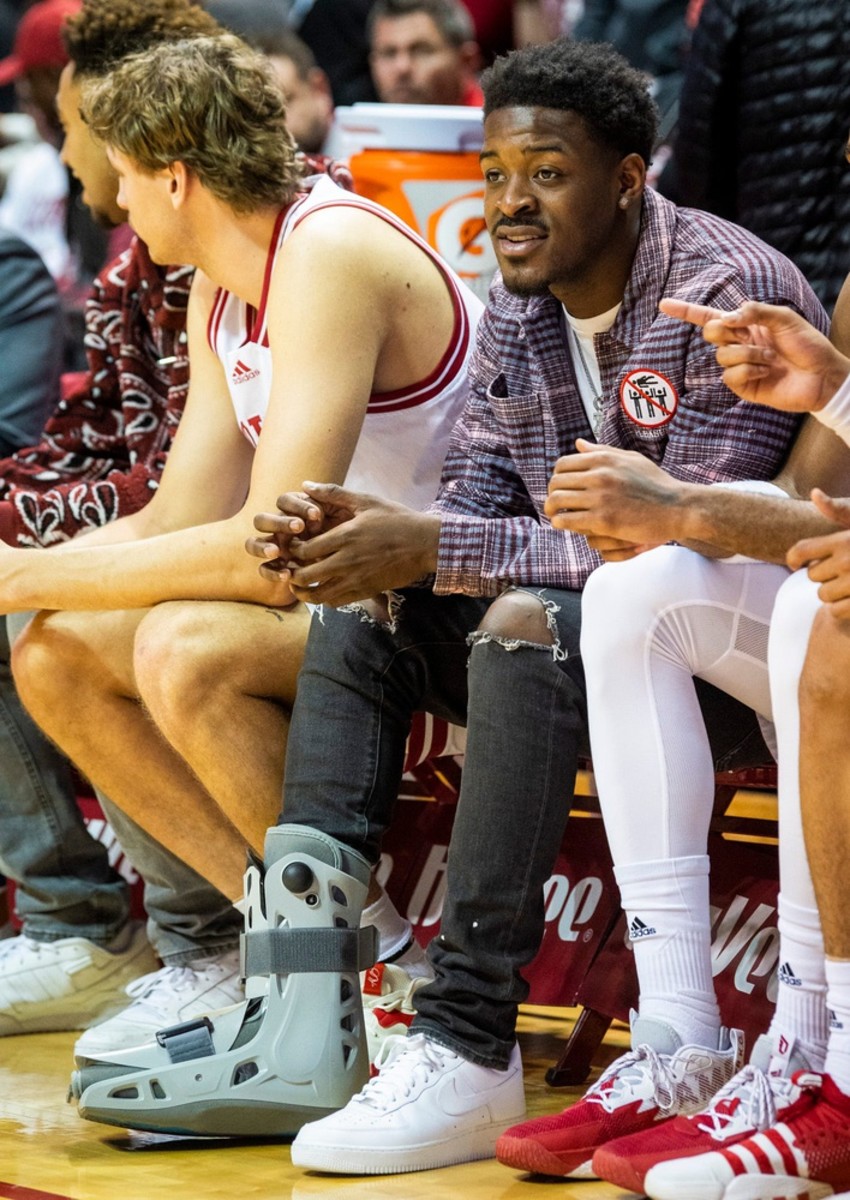 Indiana guard Xavier Johnson sits on the bench Tuesday with a boot on his right foot. He had surgery on Wednesday and will miss several weeks. (USA TODAY Sports)